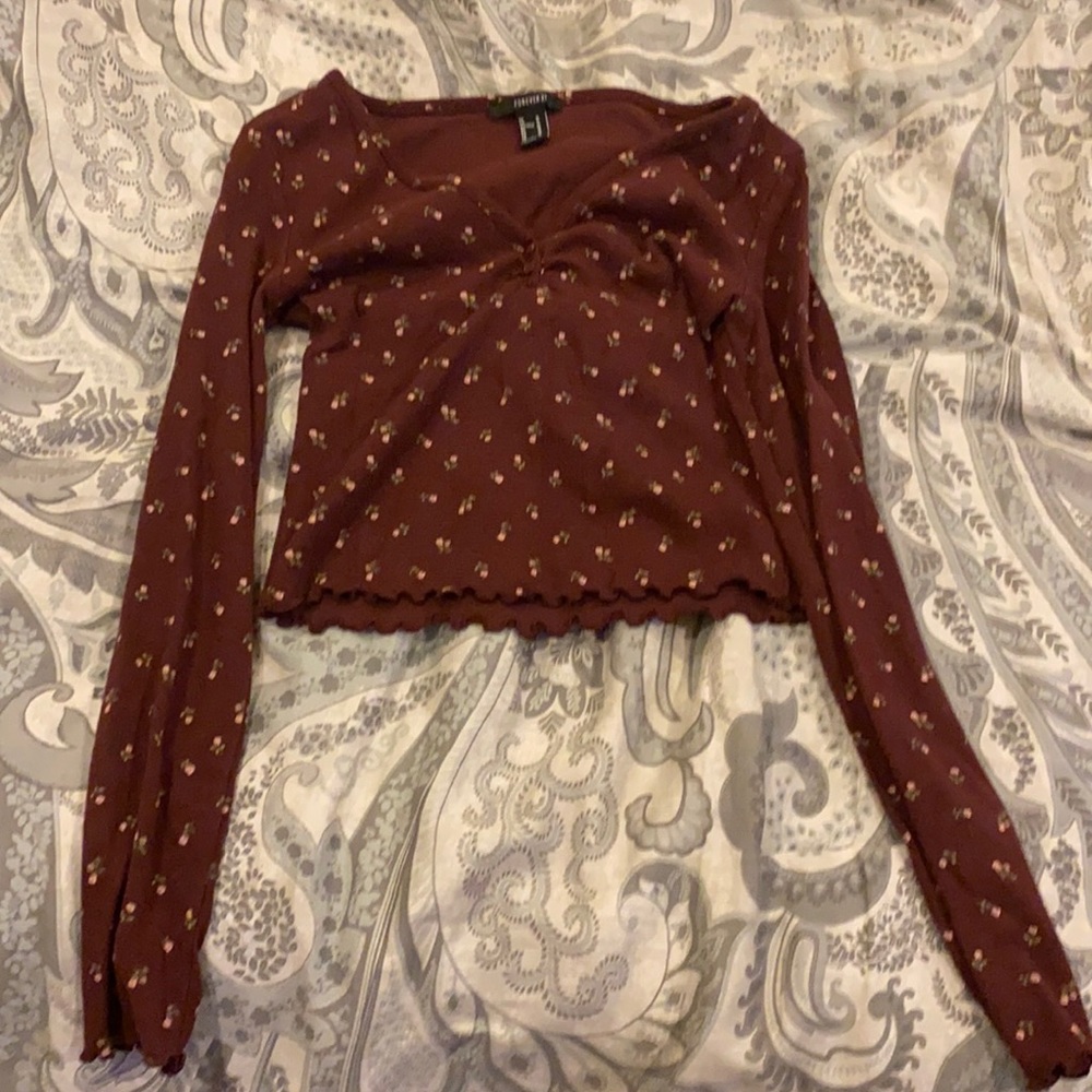 A long sleeved crop top with pink roses